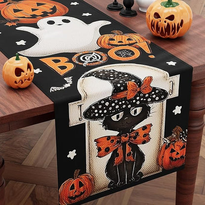 Black Halloween table runner with white ghost, jack-o-lantern pumpkins and spiderweb motifs