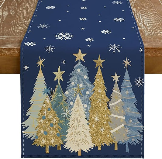 Blue Christmas table runner with snowflakes and layered winter trees in gold, cream, and light blue