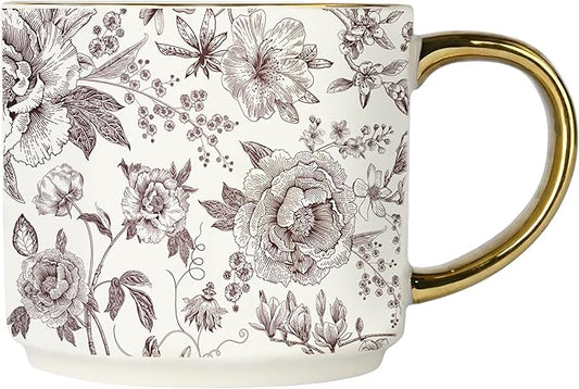 White porcelain mug with purple floral pattern and gold handle