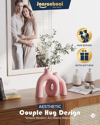 Light pink matte ceramic hug vase with conjoined donut opening, tabletop decor