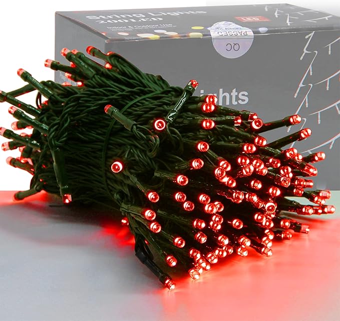 Red mini Christmas string lights with green wire, close-up view of glowing bulbs