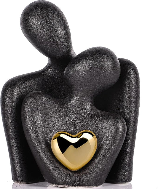 Mini couple statue decor: matte black figure with gold heart pendant on chest