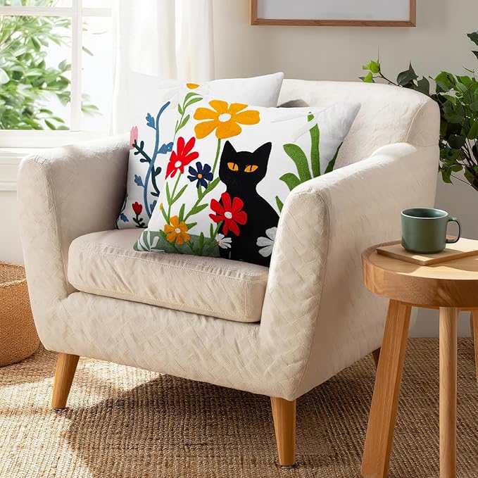 Embroidered throw pillow cover showing a black cat face with colorful flowers