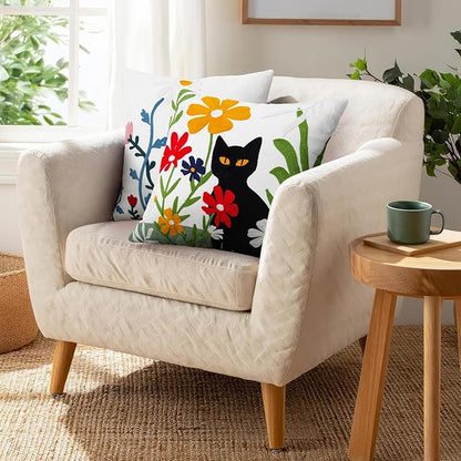 Embroidered throw pillow cover showing a black cat face with colorful flowers