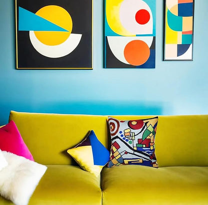 Embroidered abstract geometric pillow cover with bold multicolor design on light base