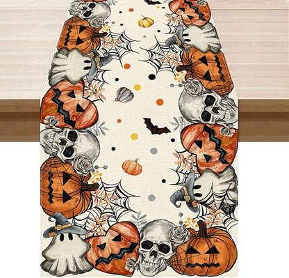 Halloween table runner with skeletons, ghosts, and orange jack-o’-lantern pumpkins on white
