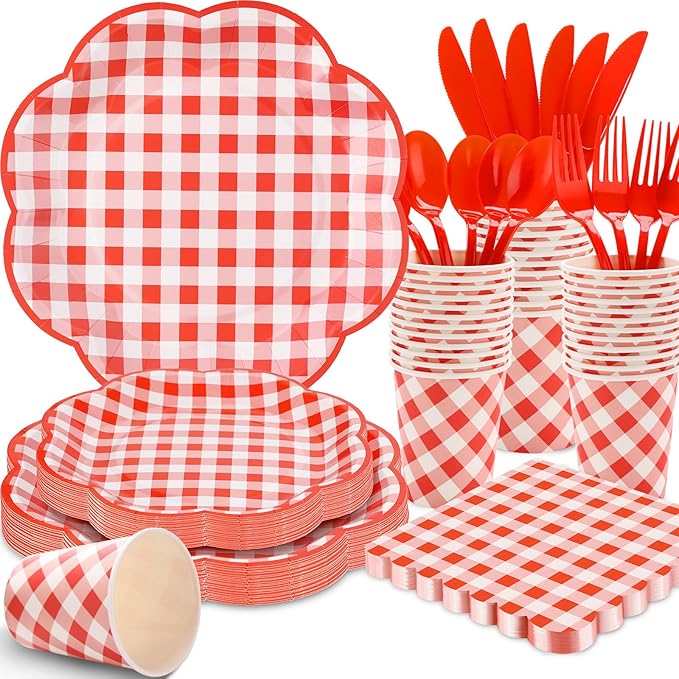 Red and white gingham picnic tableware set with plates, cups, and red cutlery stacks
