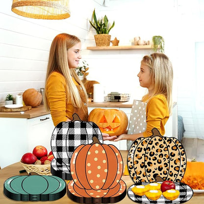 Pumpkin-shaped paper party plates, orange polka, leopard print, teal, and black plaid