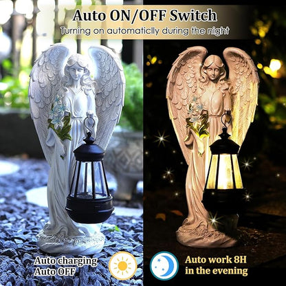White angel solar garden statue with lantern lighting at night