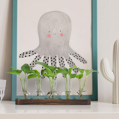 Clear glass bulb vases with green seedlings on brown wooden tray display