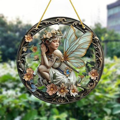 Circular fairy ornament with translucent blue wings, floral frame, and gold hanging cord