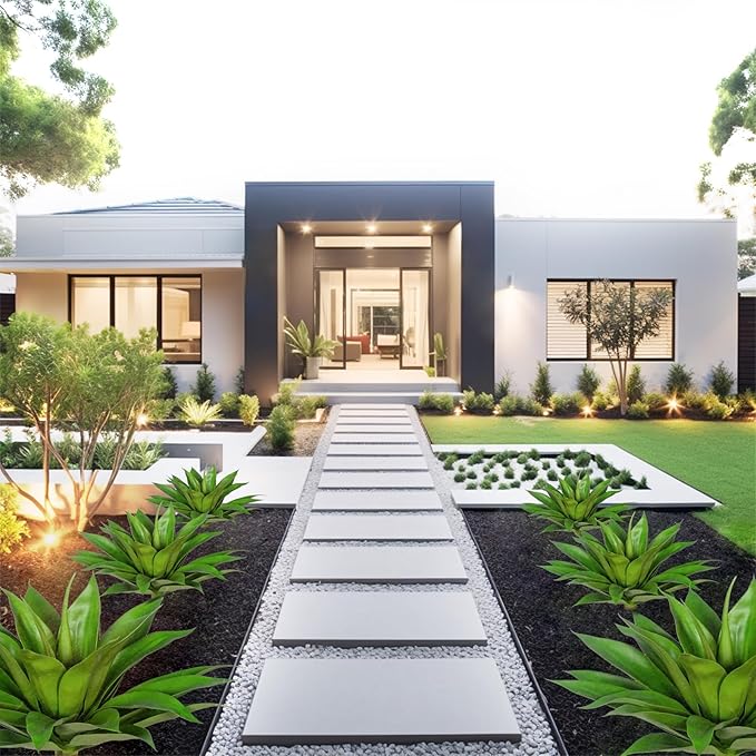 Multiple small artificial green agave plants with white pots in garden walkway