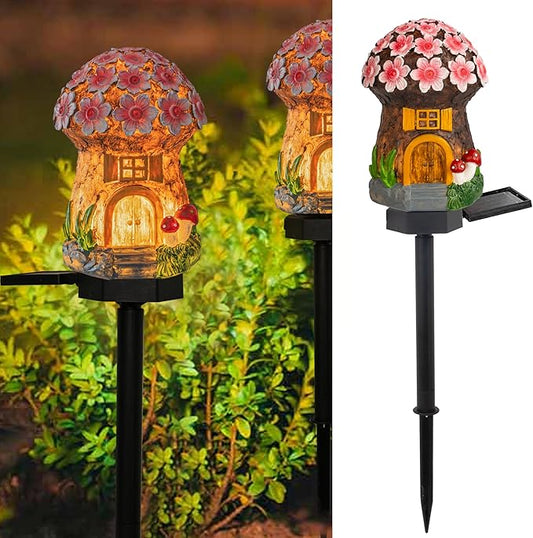 Solar mushroom house landscape light with floral cap and glowing doorway on stake