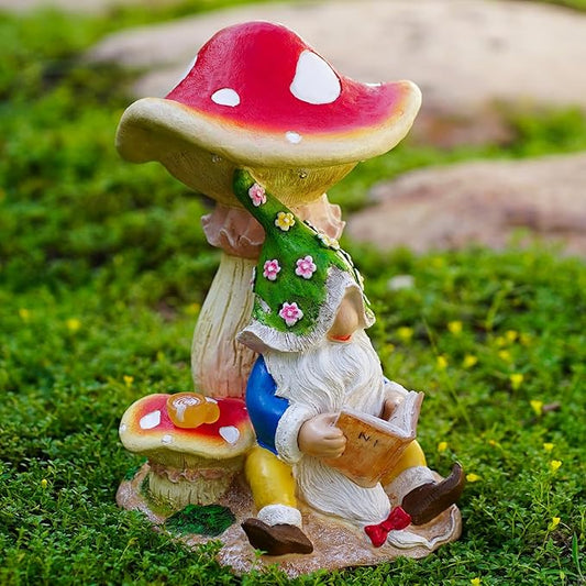 Solar gnome figurine reading under red mushroom cap, warm LED glow on base