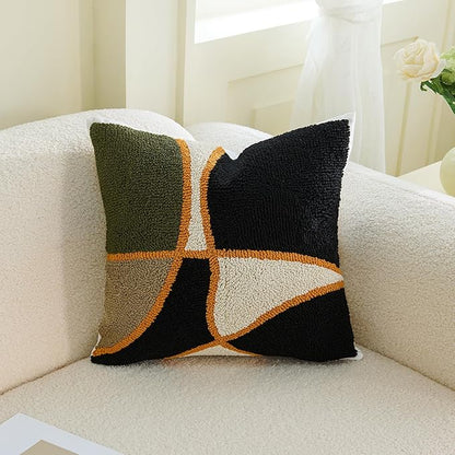 Square tufted pillow cover set with green, black, tan geometric cross and orange trim