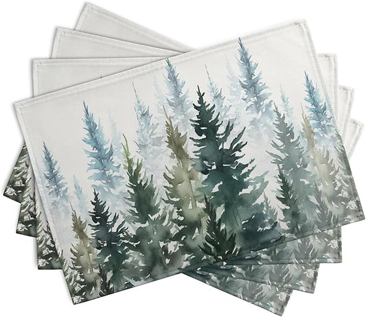 Set of 4 watercolor pine tree table mats fanned out, dark green tree silhouettes on white