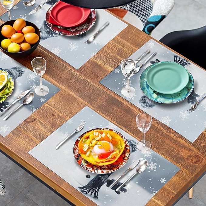 Blue snowman placemats spread across table with plates and cutlery, snowflake design