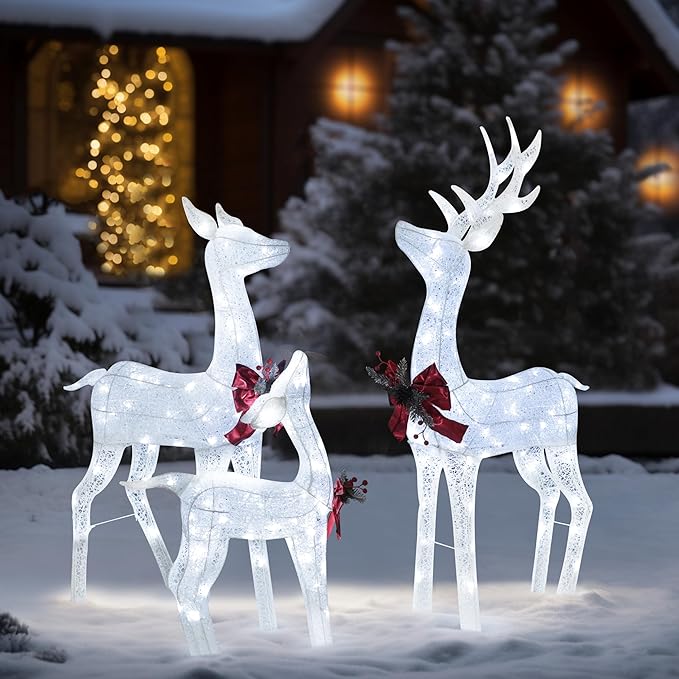 Glittered white pre-lit reindeer family decoration set with red bows, standing three deer