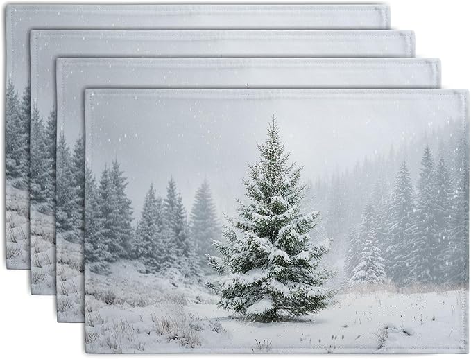 Set of 4 winter placemats with snowy pine tree scene, light gray fabric.