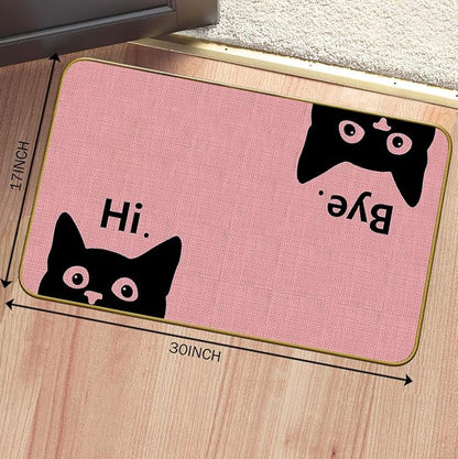 Pink welcome doormat with black cat faces and “Hi” text, 30 in by 17 in