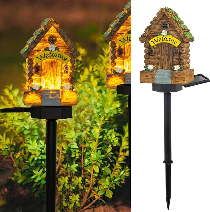 Mini wooden fairy garden house light with “Welcome” sign on a black stake, glowing yellow.