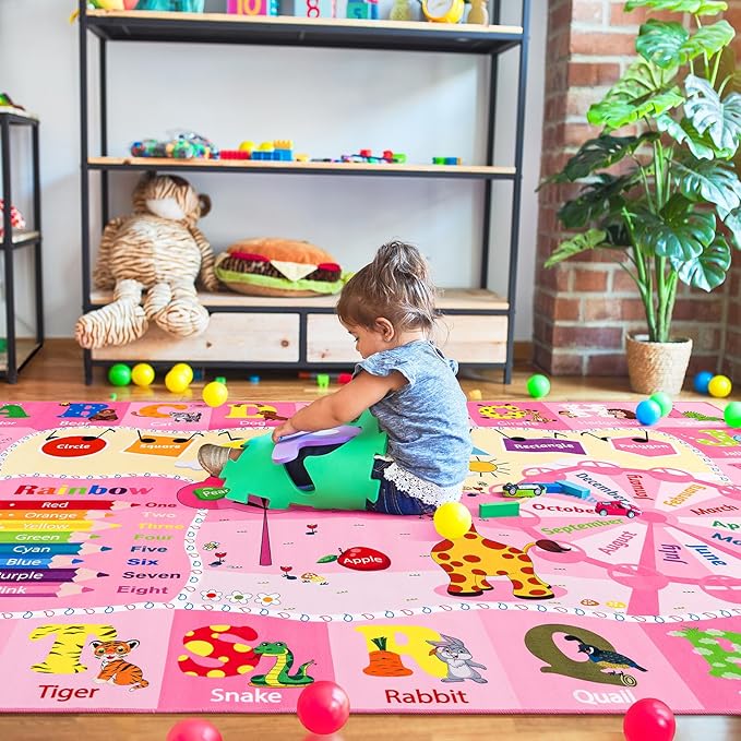 Pink educational kids rug with animal and color/number labeled sections.