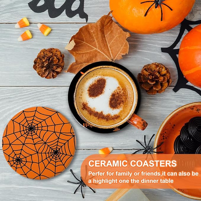 Orange-and-black Halloween ceramic coaster on tabletop next to a mug