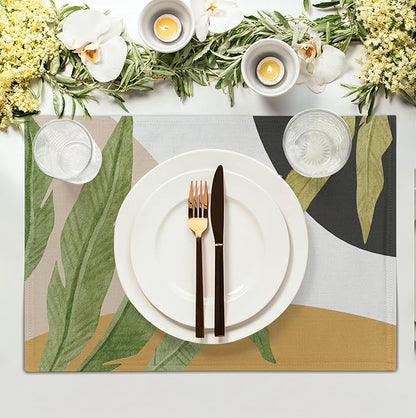 Tropical leaf placemat with green banana and palm leaves on white, tan bottom edge
