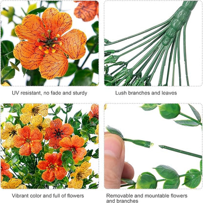 Artificial flower bundle detail: orange blossoms with green stems and clustered green leaves