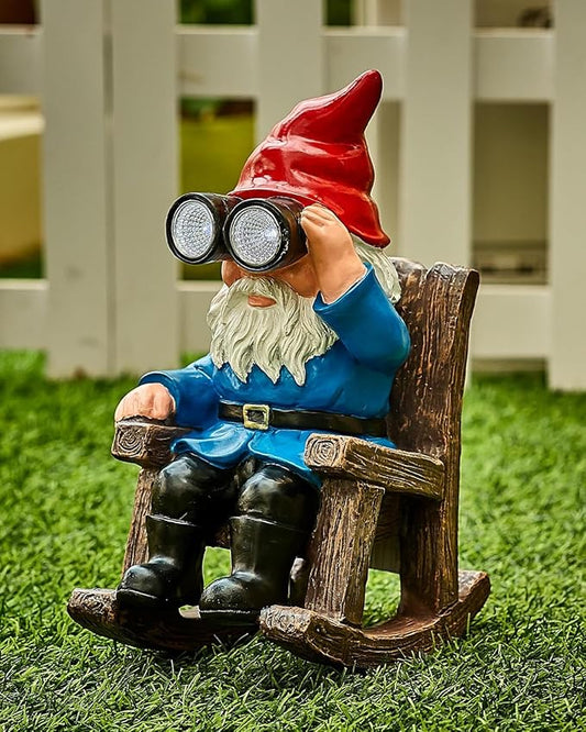Resin gnome figurine on a rocking chair with red hat, blue coat, and binocular telescope