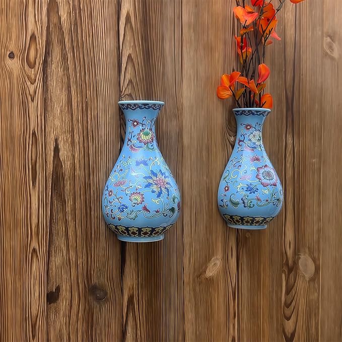 Set of two blue chinoiserie porcelain wall vases with floral motifs