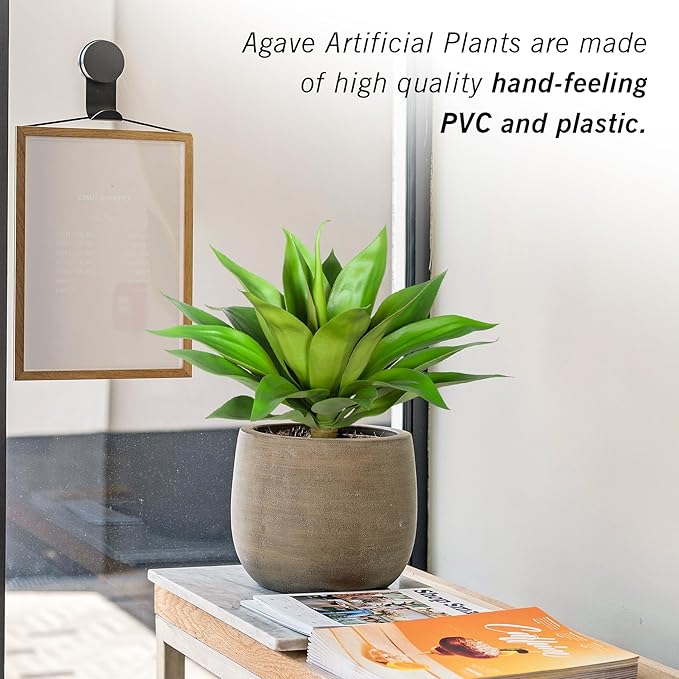 Green faux agave plant in gray textured pot