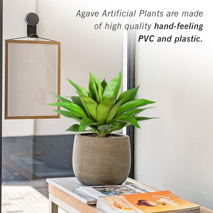 Green faux agave plant in gray textured pot