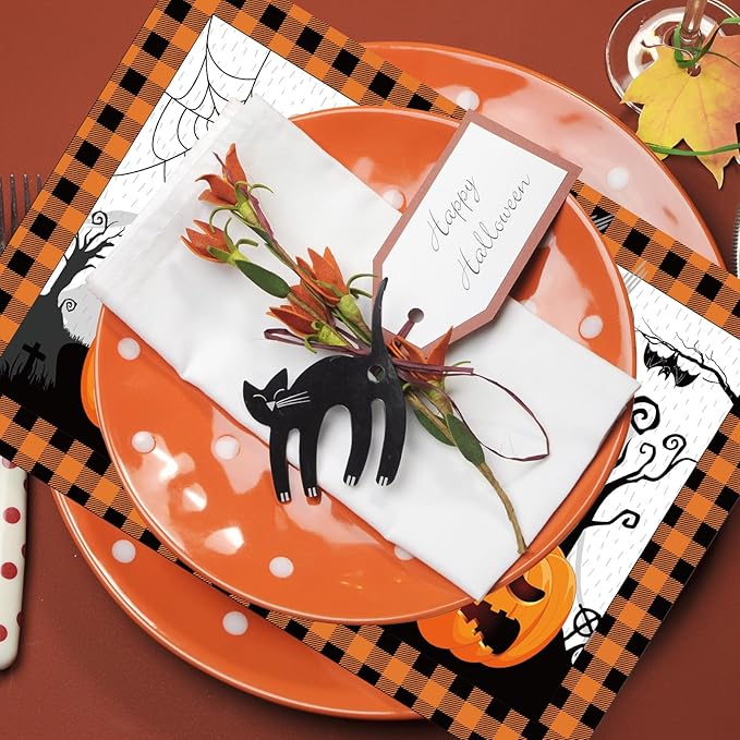 Printed paper placemat with black cat and orange pumpkin accents on plaid border