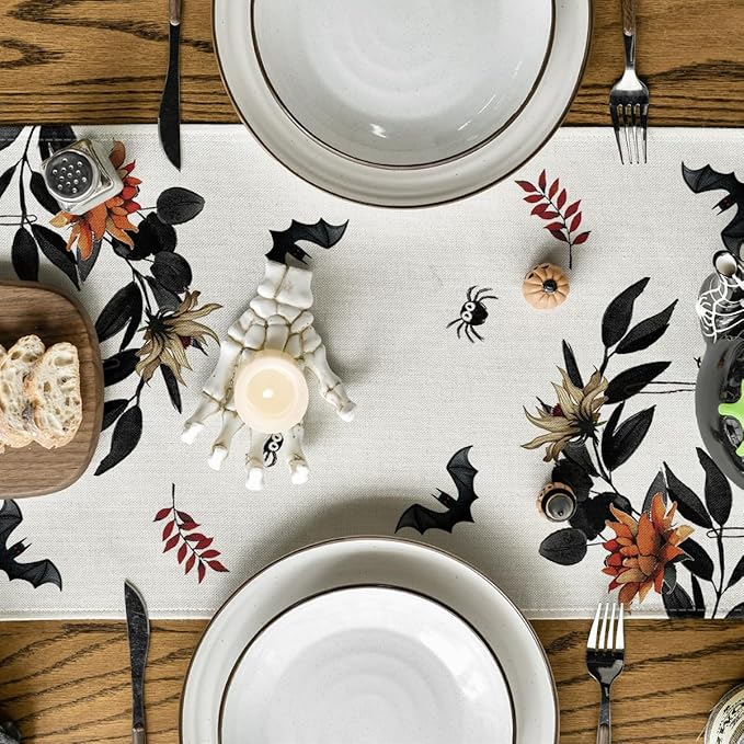 Beige Halloween table runner pattern with spiderweb, bats, pumpkins and flowers