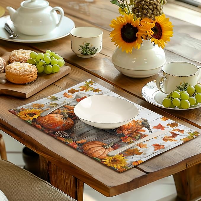 Cotton-linen placemats with pumpkin and leaf print on a dining table with teapot and plates