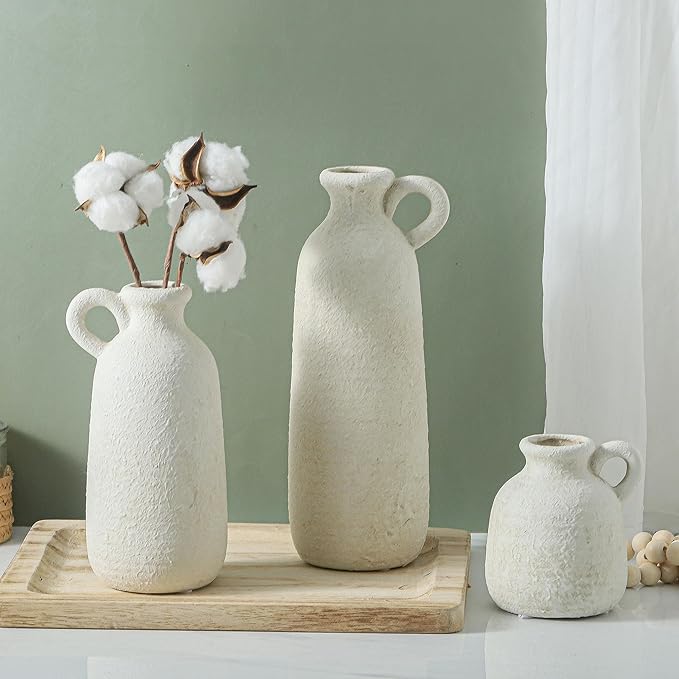 Set of 3 white ceramic vases with loop handles, tall central vase with two shorter matching vases
