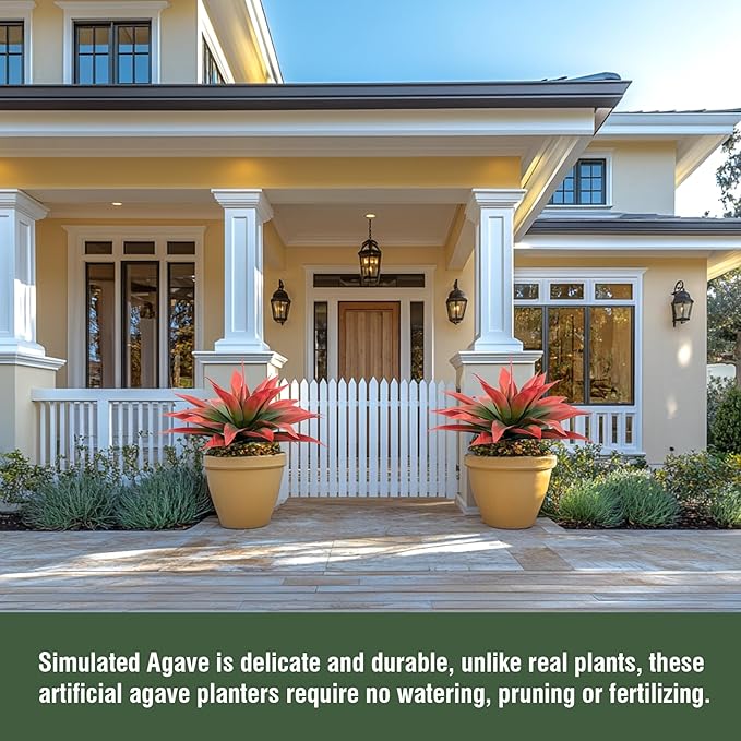 Two red and green faux agave plants in yellow pots on a porch walkway