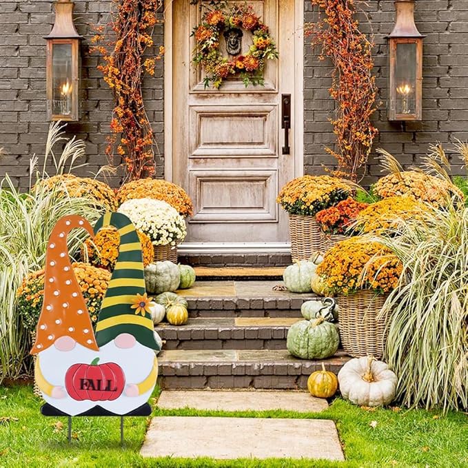 Outdoor fall gnome yard stake with orange polka-dot robe, green striped hat, and “FALL” pumpkin