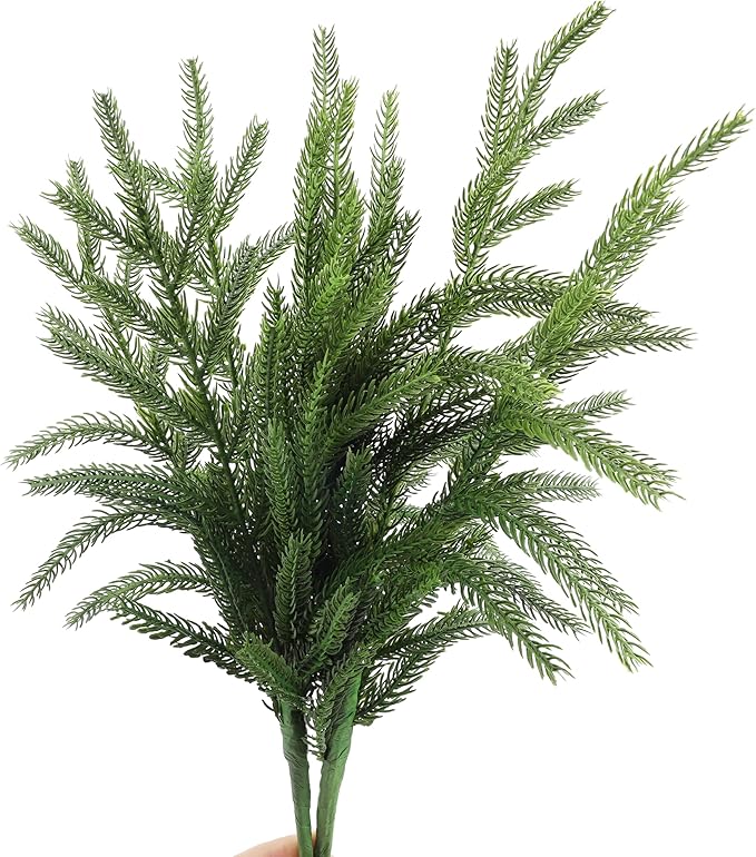 Green faux pine branch stem, full needle foliage on a straight green stem