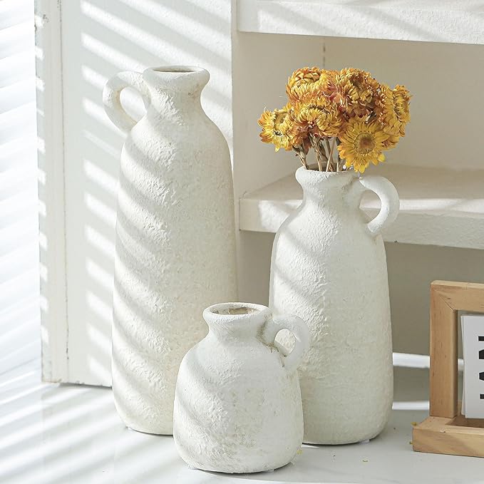 Set of 3 white ceramic vases with loop handles, stacked view showing three heights
