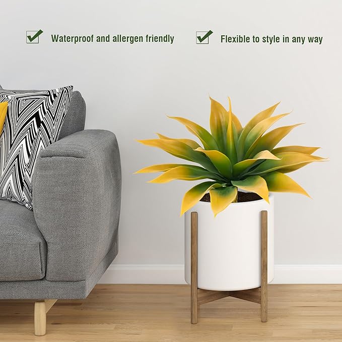 Yellow-green faux agave plant in white planter pot with faux trunk stem