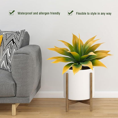 Yellow-green faux agave plant in white planter pot with faux trunk stem