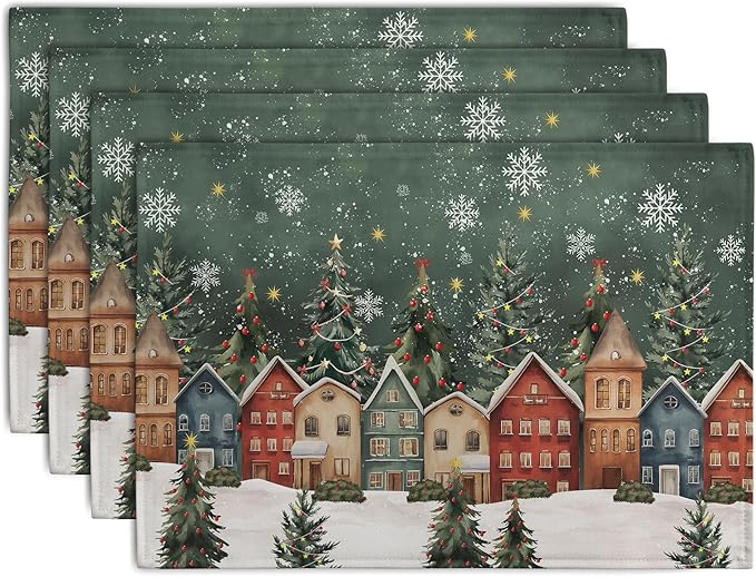 Set of 4 green Christmas placemats with snowy village, fir trees, and white snowflakes