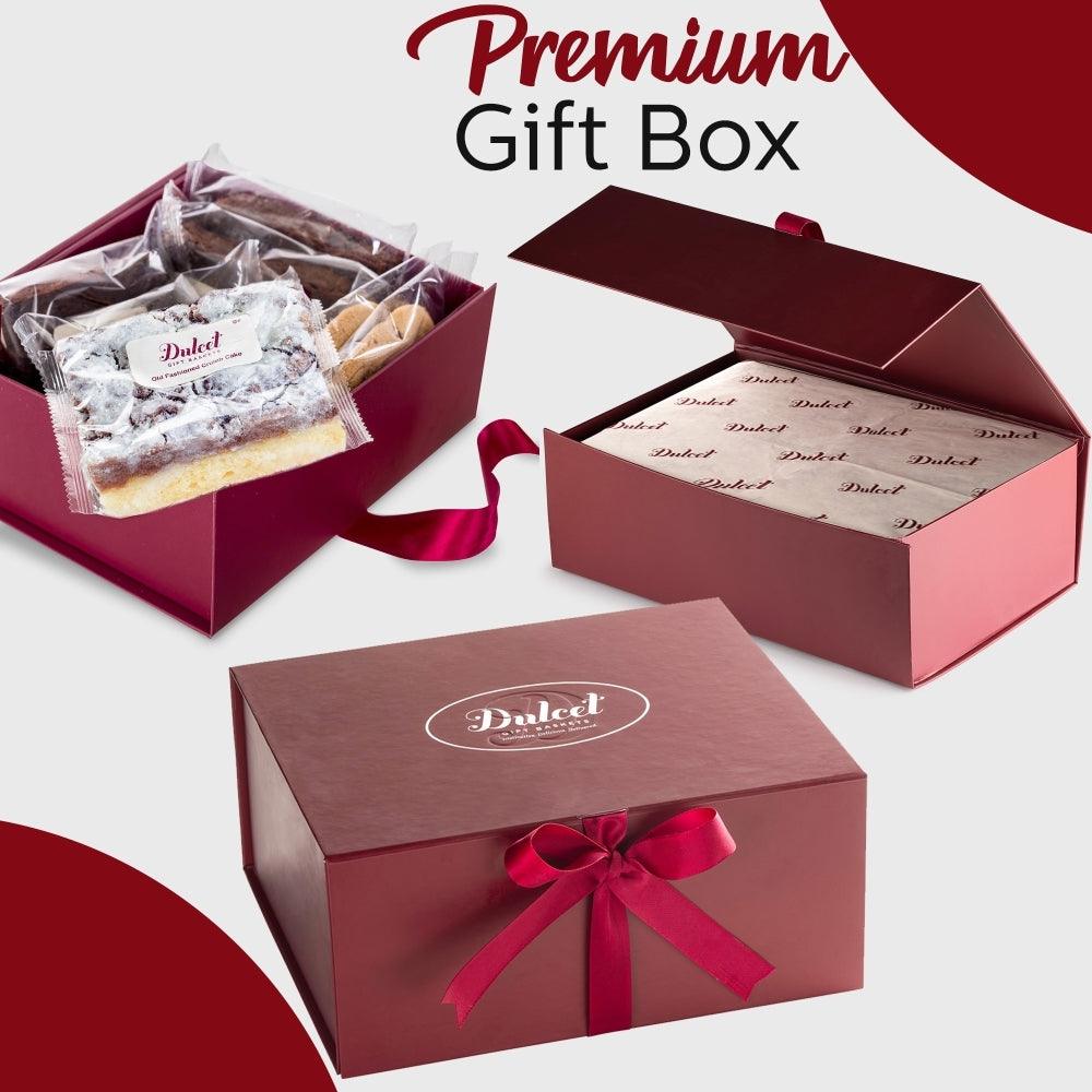 Premium gift box with red ribbon, filled with assorted wrapped pastries