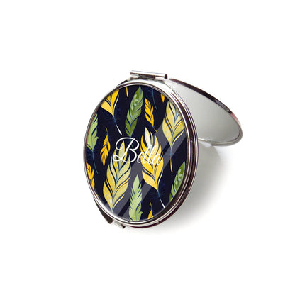 Open feather-patterned compact mirror with silver trim