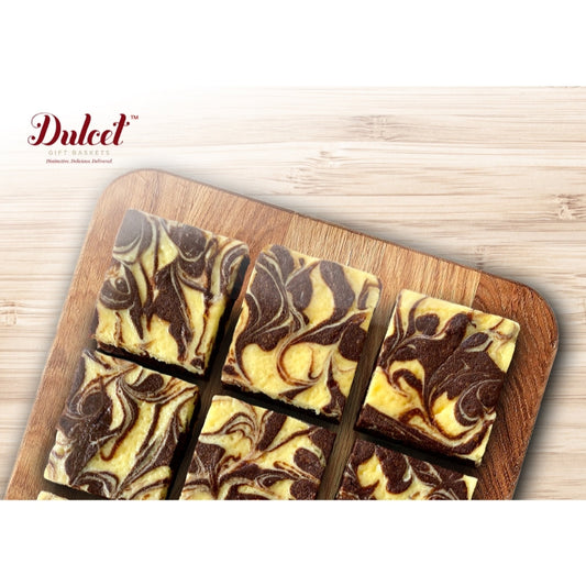 Assorted chocolate and vanilla swirled bar cookies on wooden tray