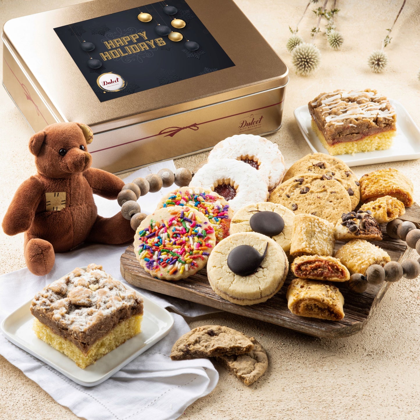 Pastry gift tin with Happy Holidays card, cookies and pastries on tray