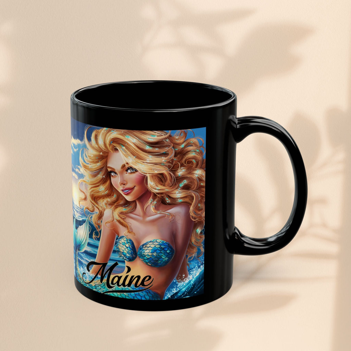 Black ceramic mug with mermaid artwork and 'Maine' text