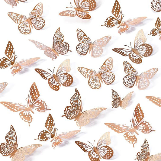Rose gold metallic butterfly wall decals, assorted sizes, scattered on a white wall